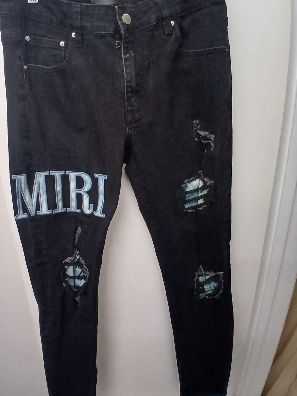 AMIRI Black Skinny Jeans with Light Blue Patch Details